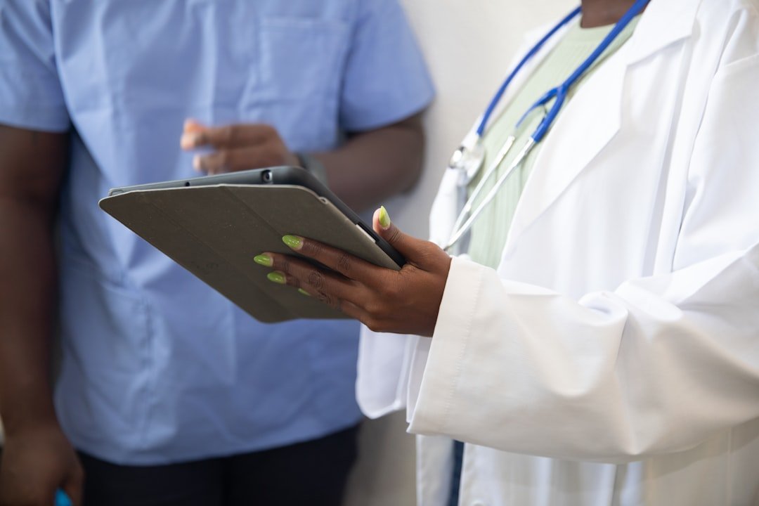 a-doctor-showing-a-patient-something-on-the-tablet-j5utvrgse7q